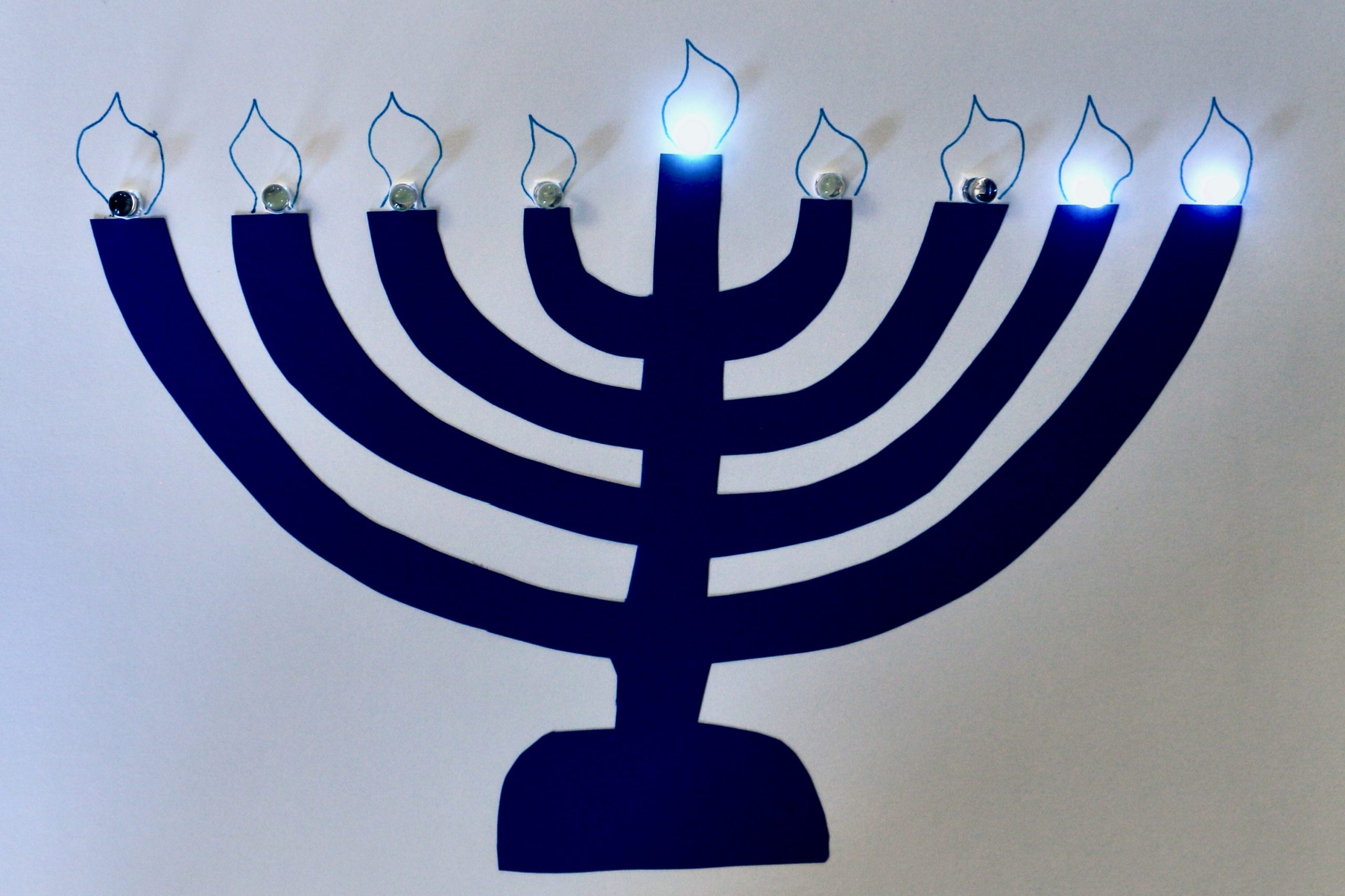 Menorah with shamash and two right candles lit.